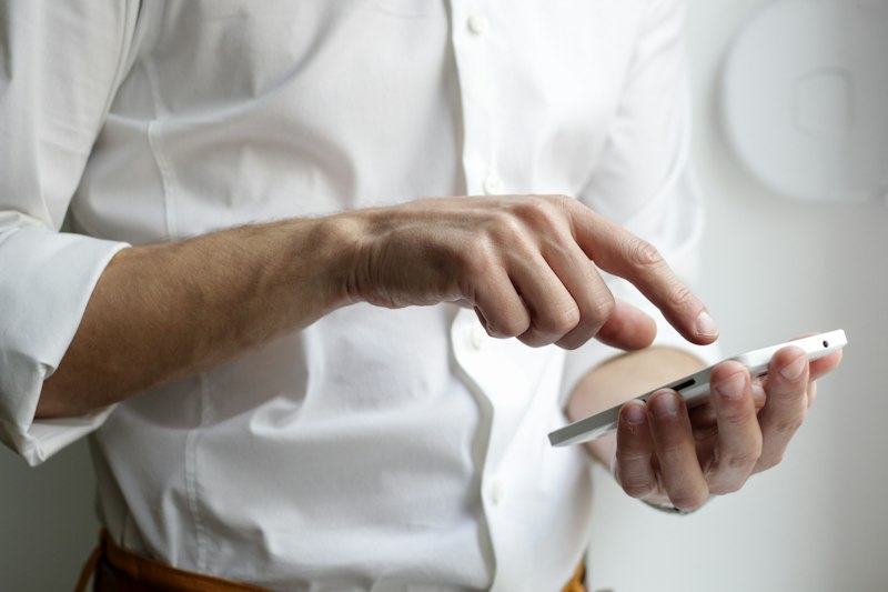 Person messaging on a smartphone