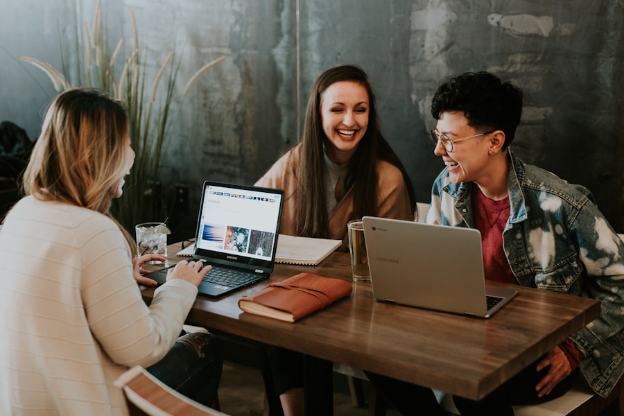A small group of data-work gig workers reviewing their laptops together